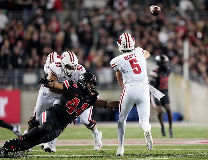 Wisconsin quarterback Graham Mertz throwing the football against Ohio State.